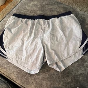 Under armour women’s shorts with inside lining. New without tags.